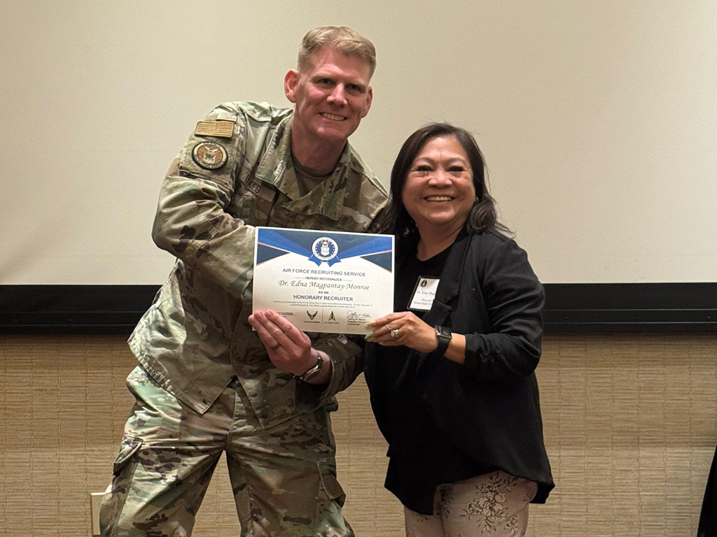 Awarding of certificate to Dean Magpantay-Monroe by Lt. Col. Christopher Dykes, Chief Officer Accessions, Branch
