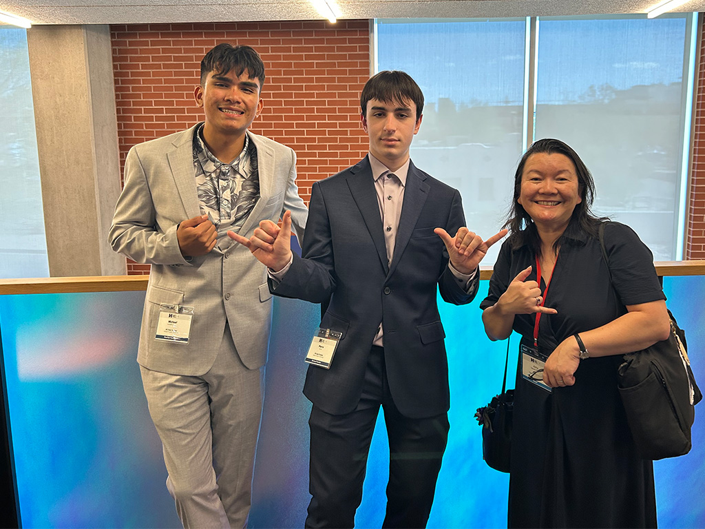 (Left to right) Michael Lozada-Longog, Pierre Erard, and Dean Amy Nguyen-Chyung represented HPU in Tucson, Arizona at the Hult Prize Nationals West Competition on April 17-18 