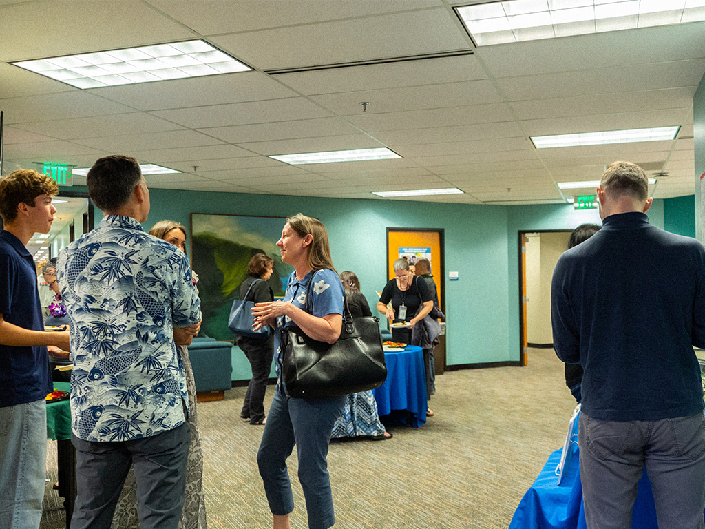 Attendees at HPU's Scholarship Day and Author Celebration included HPU Dean Brenda Jensen (center, in blue), who introduced the main purposes of the event