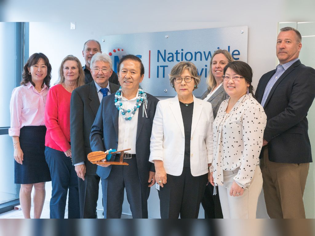 Inaugural HPU Alumni Entrepreneur Awardee C.K. Park (with lei), HPU President John Gotanda (left of C.K. Park), and the leadership team of Nationwide IT Services