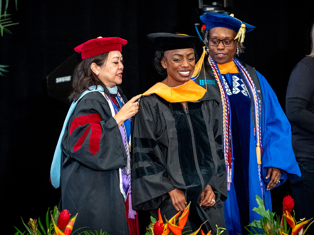 A HPU Doctor of Nursing Practice (DNP) student with School of Nursing Dean Edna Magpantay-Monroe (left)