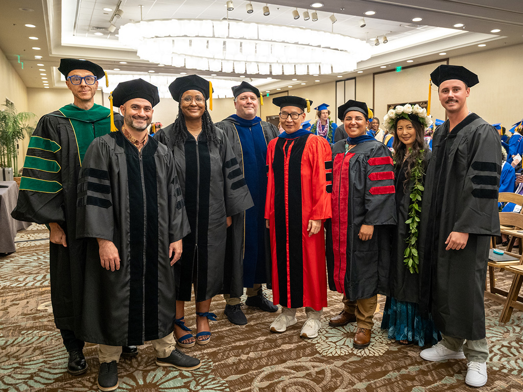 HPU Doctor of Clinical Psychology (Psyd) students, with program faculty, moments before graduation