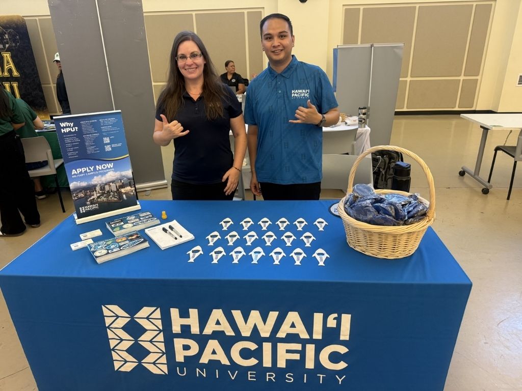 At the Ka Huakaʻi Hawaiʻi Army National Guard event, Assistant Directors of Admissions for Military Campus Programs Rachel Jones and Jo Roberto engage with soldiers and family members 
