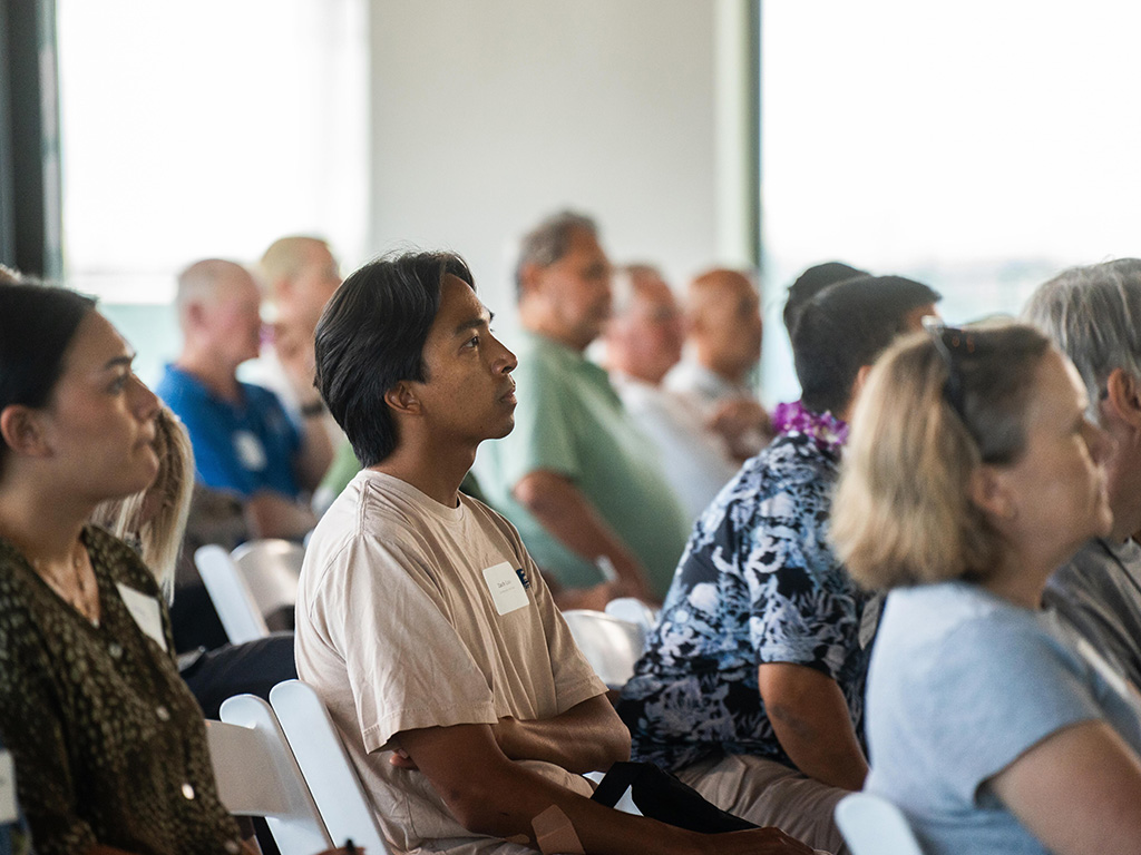 Audience members watch a presentation at the HPU Talks: Evaluating Genki Balls for Hawai'i's Waterways symposium on July 17