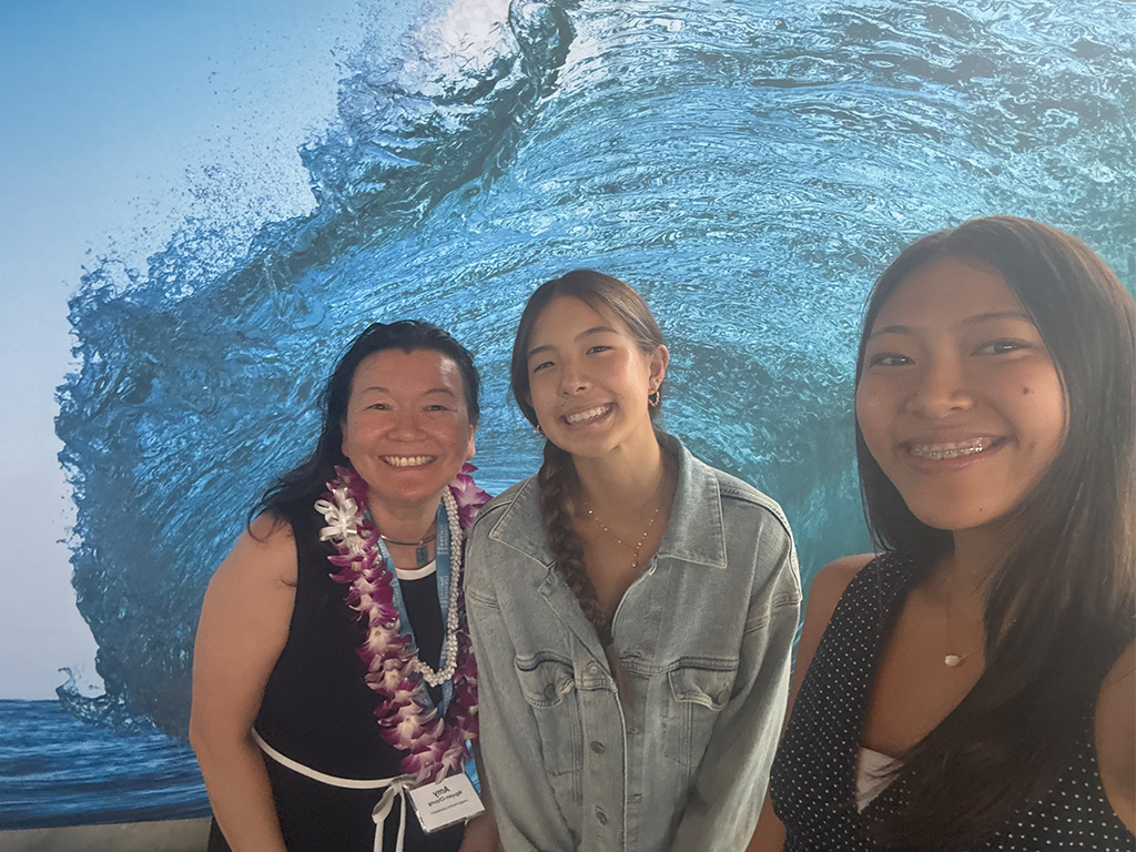 HPU Dean Amy Nguyen-Chyung with two Hawai'i high school students