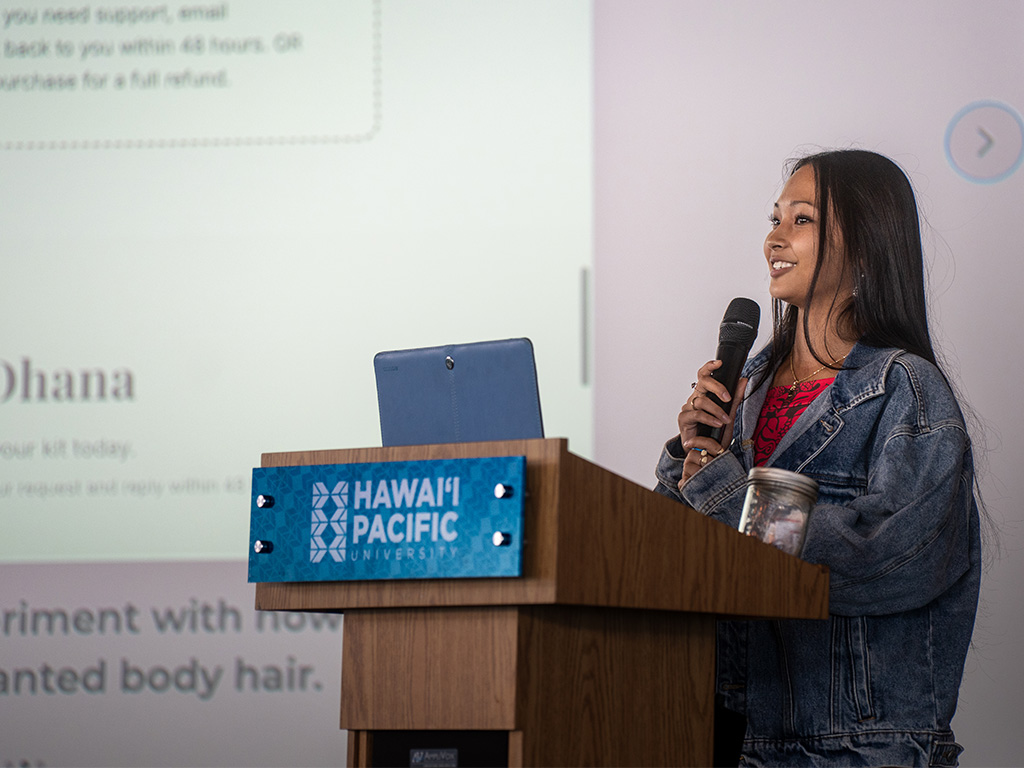 A Hawai'i high school student presenting her venture on presentation day