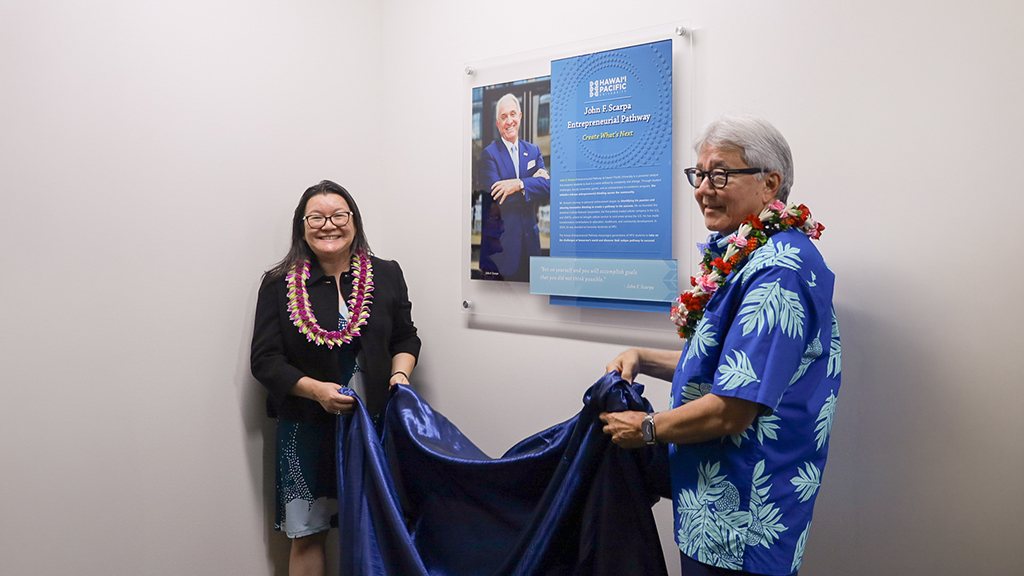 Dean Amy Nguyen-Chyung and HPU President John Gotanda unveiled the John F. Scarpa plaque at the HPU College of Business