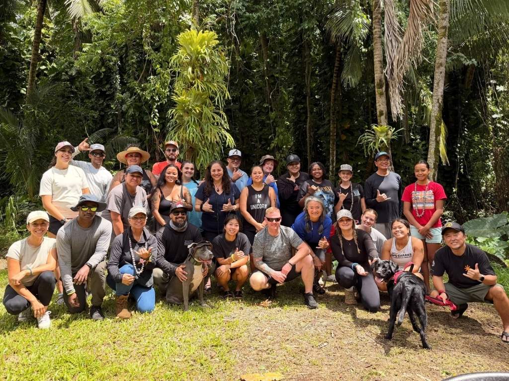 School of Social Work students, faculty, and community partners gather for a group photo at Aina Wellness Academy