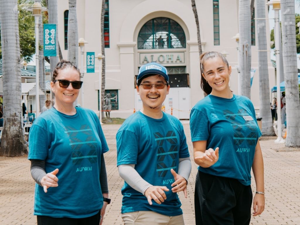 Assistant Director Marissa Romero, far right, standing alongside her fellow Student Engagement team members, Associate Dean of Students Robyn Serge, far left, and Assistant Director Dyson Chee, is excited to make this year's Club Carnival a memorable one