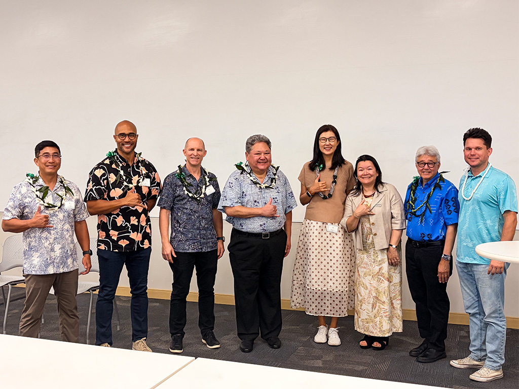 From left: Iven Sugai, Kenji Price, Jason D'Olier, Jason Higa, Rebecca Cai, Amy Nguyen-Chyung, John Gotanda, Michael Bennett pose for a photo at Hawaii Tech Week's AI Strategy Panel at HPU's Aloha Tower Marketplace