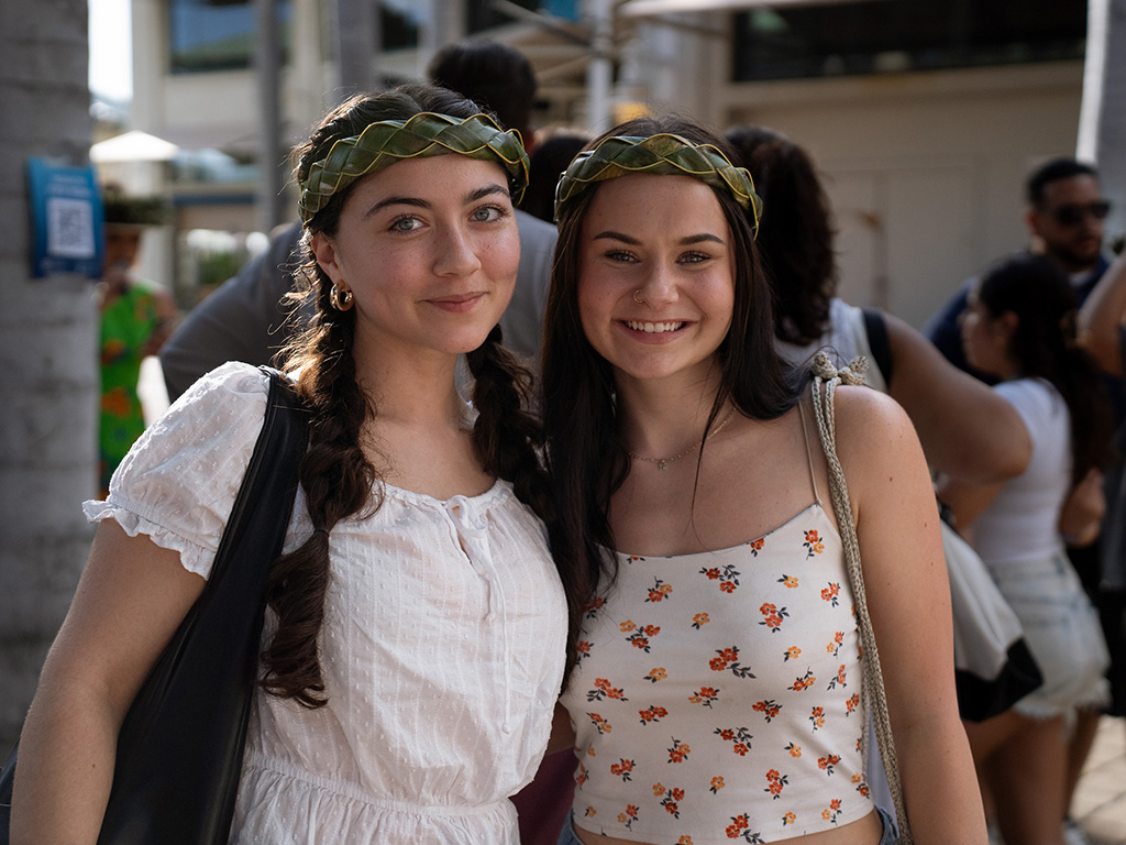 New HPU students celebrate the evening before the luau performance at Aloha Tower Marketplace