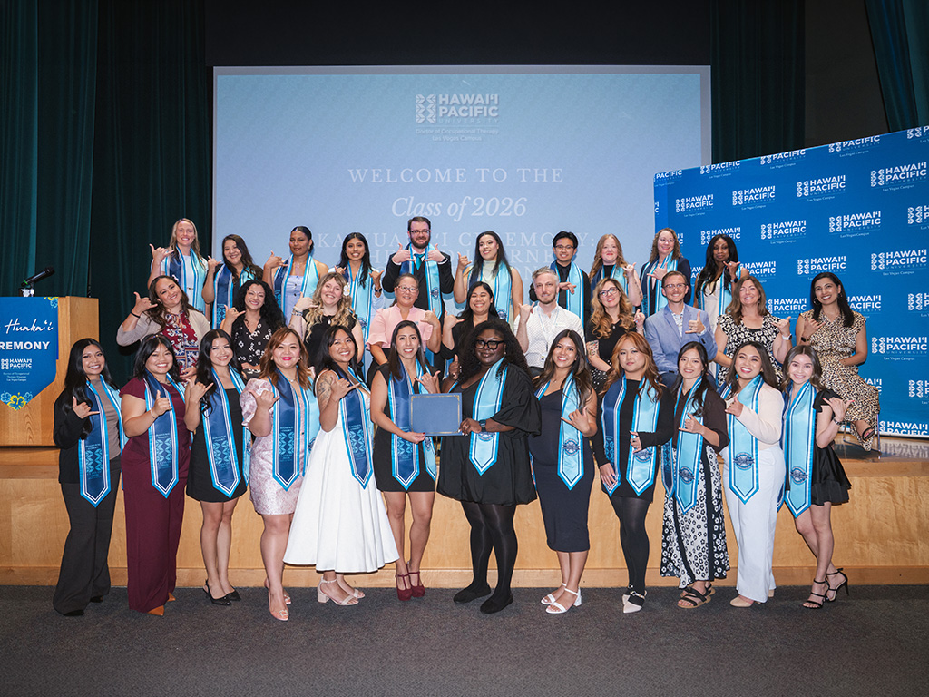 HPU's inaugural Las Vegas OTD cohort celebrates with faculty upon completing program requirements