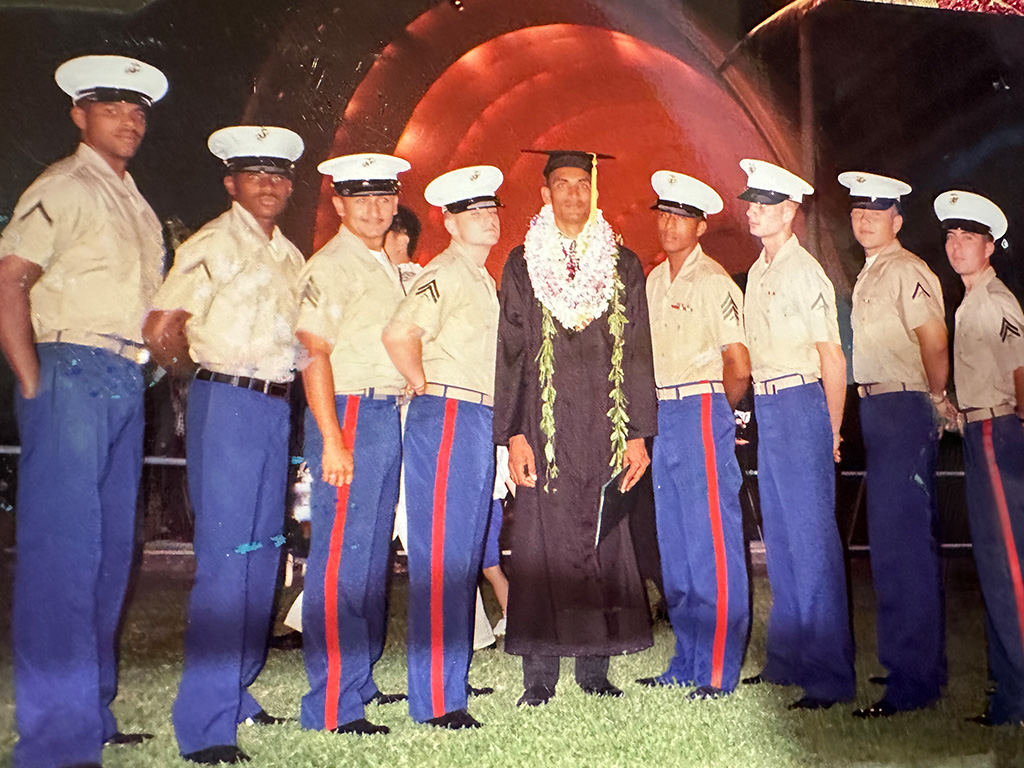Jahidul (center) is joined by fellow Marines, who surprised him by attending his HPU undergraduate commencement in uniform