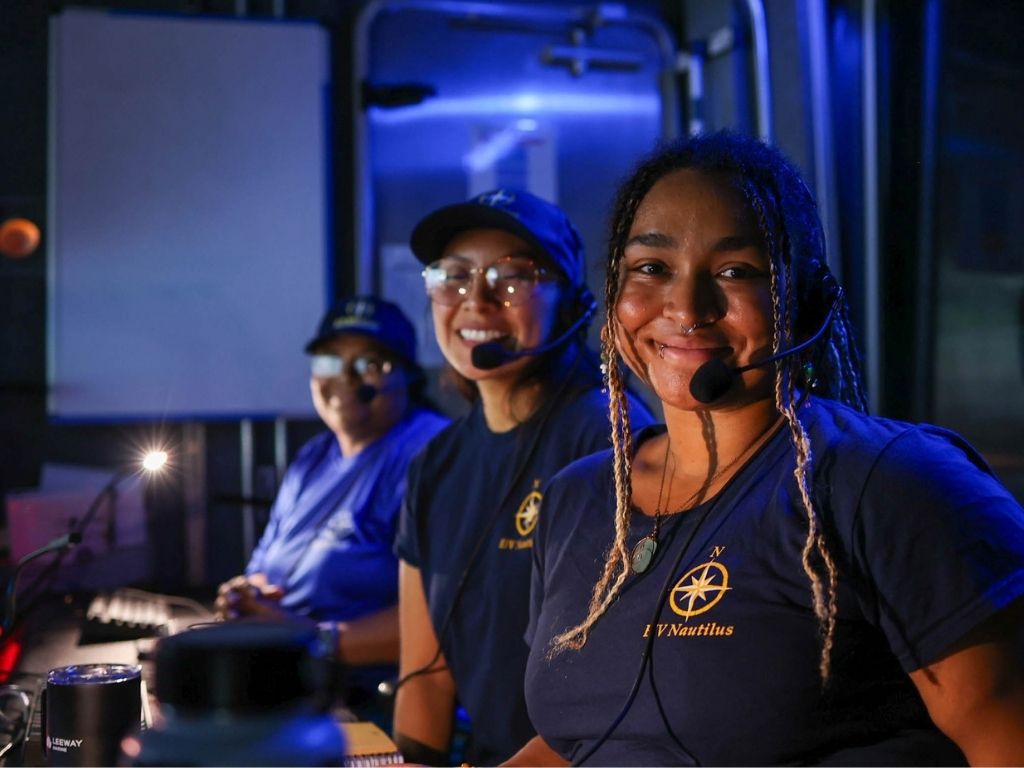 Ogbaekwe, foreground, works alongside fellow Nautilus team members in the ship's control room
