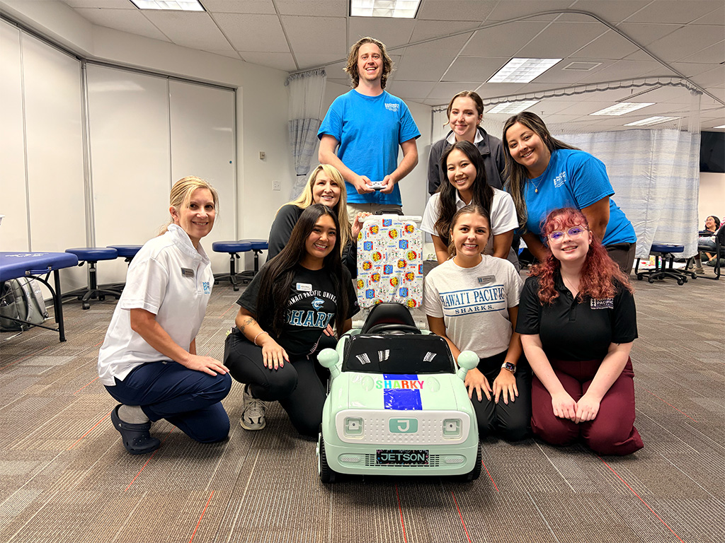 HPU Doctor of Occupational Therapy students at the third annual GoBabyGo event held at HPU's Graduate College of Health Sciences laboratory