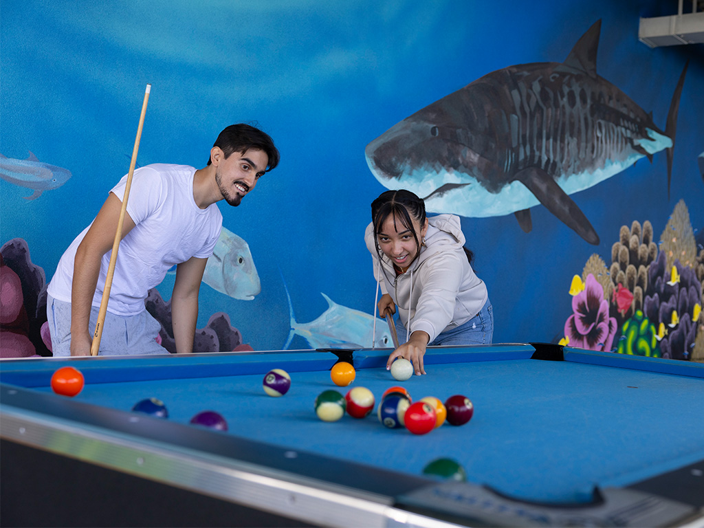 Sharky's Cove includes pool tables and ping pong tables