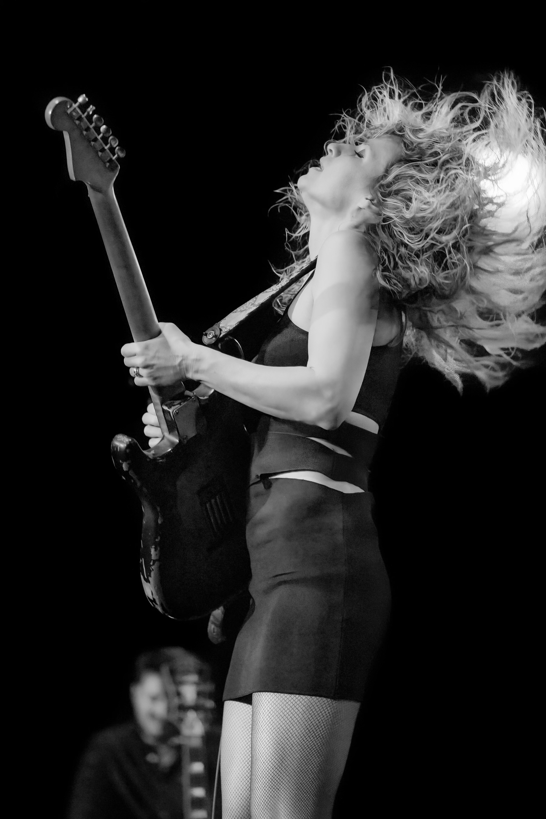 Ana Popovic playing guitar on stage