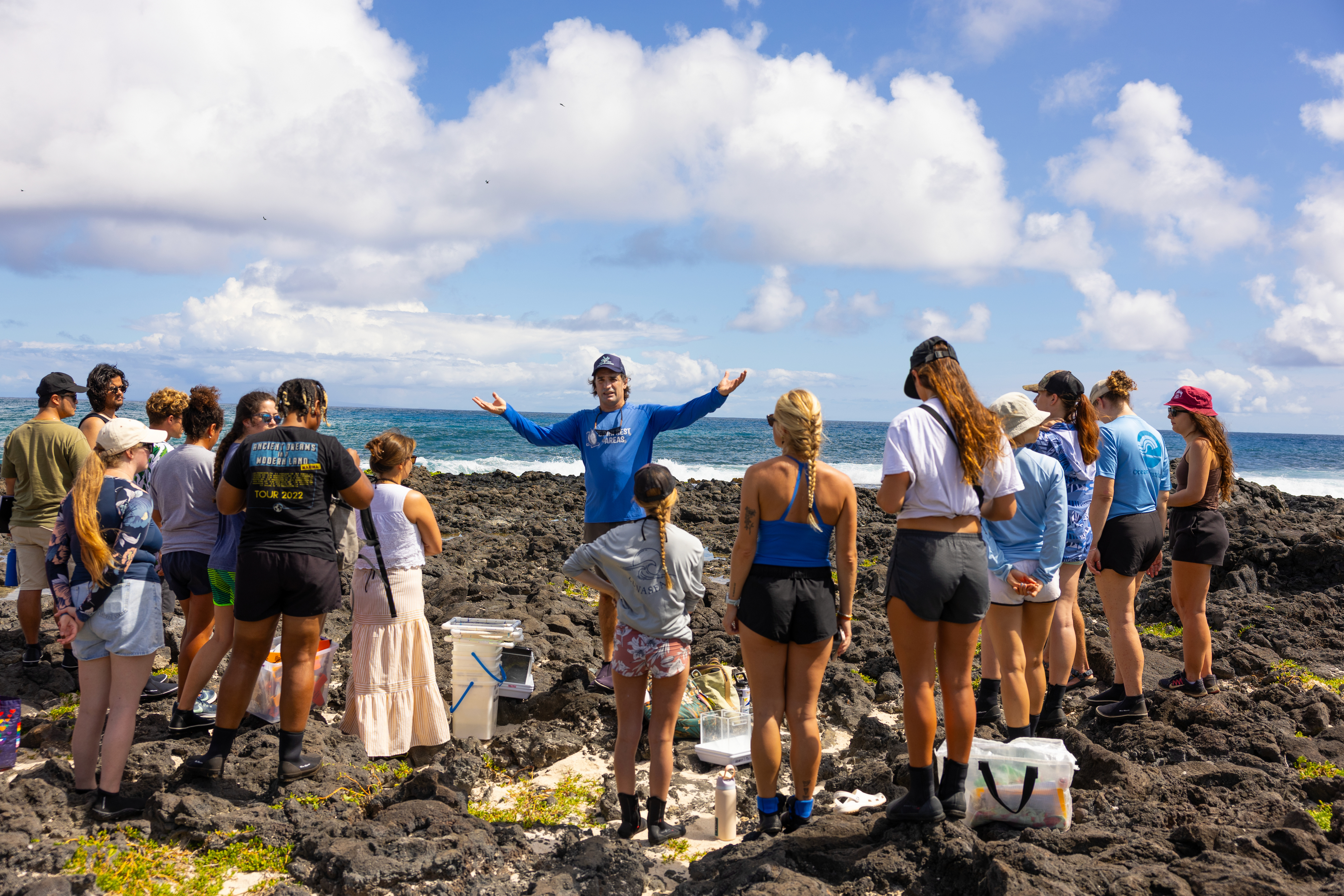 group of marine science students learning outside at the tide pools