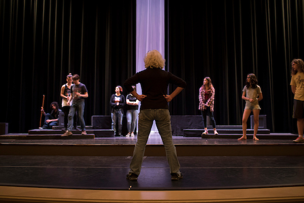 Faculty in power pose in Theatre room