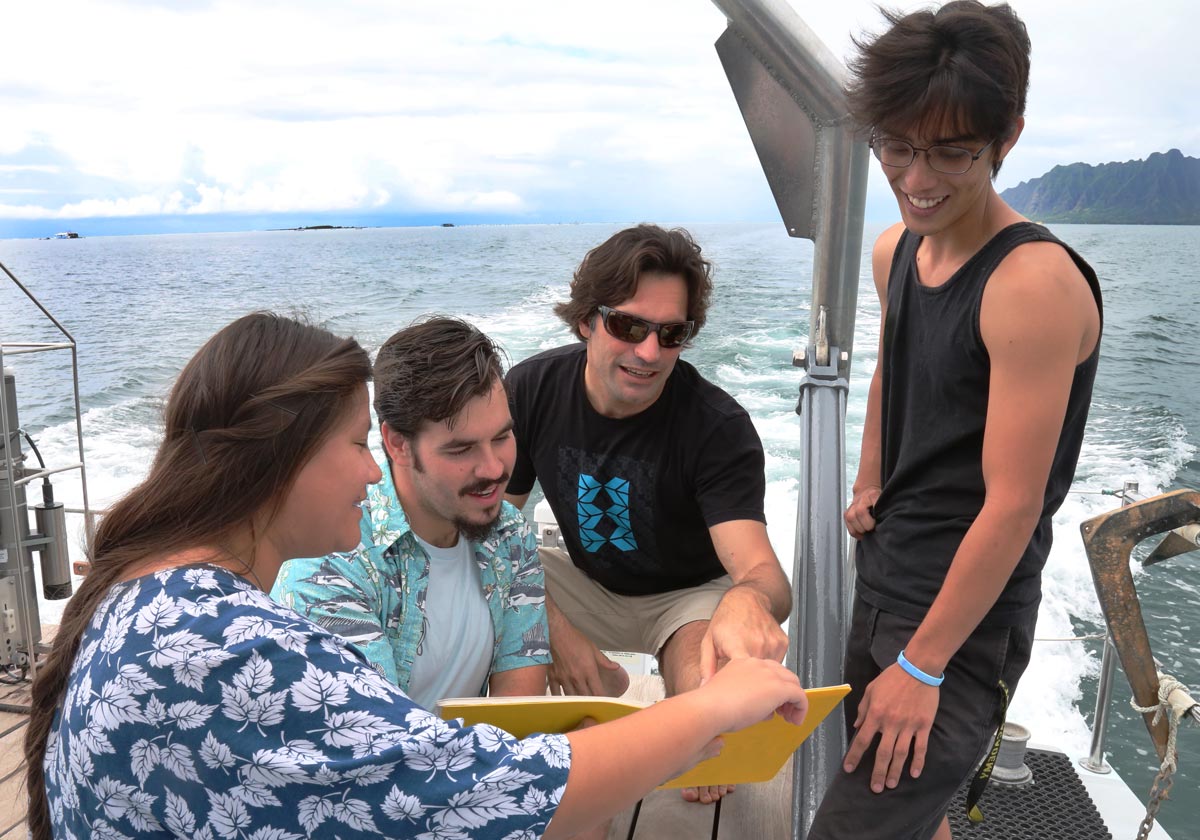 students doing research on a boat